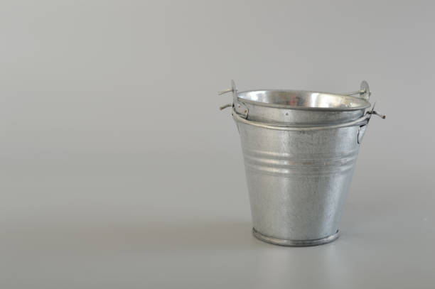istock Silver metal bucket isolated on a grey background. 1497139879