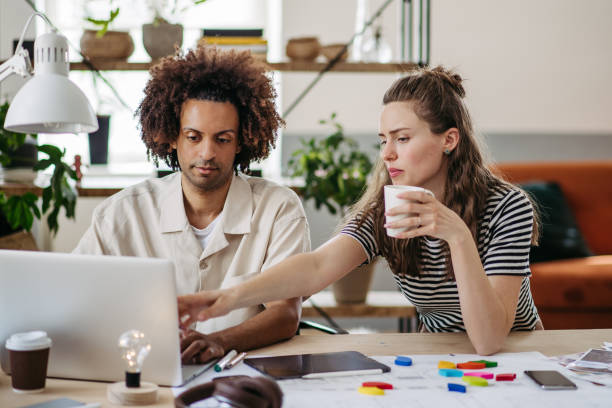 istock Young colleagues working together in photo atelier. 1497140634