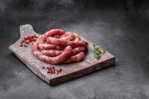 istock Raw sausages from pork or beef with salt, spices and herbs 1497142170