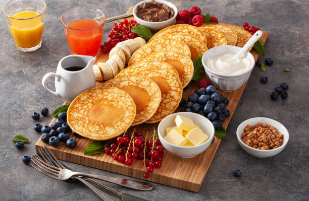 istock american pancake board with bacon berries maple syrup butter 1497142601