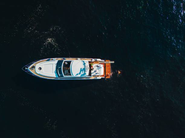 istock Boat sailing on the blue ocean 1497146581