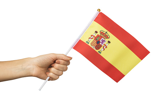 Spanish flag in female hand isolated on white background, template for designers