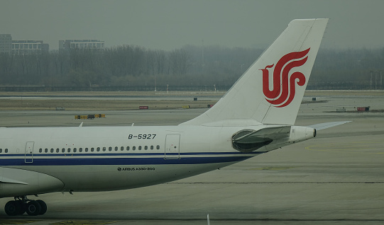 Beijing, China - Feb 17, 2018. An Airbus A330-200 airplane of Air China taxiing on runway at Beijing Capital International Airport (PEK).