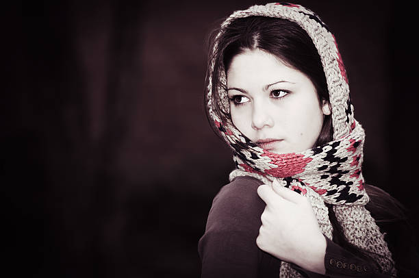 istock The woman in a knitted scarf 149714950