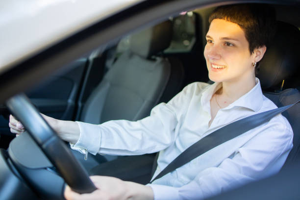 istock Young woman is driving a car 1497151035