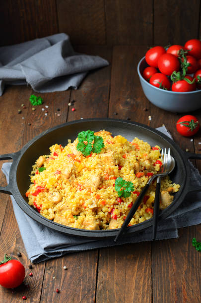 istock Chicken and Vegetables Bulgur in a Pan over Wooden Background 1497151358