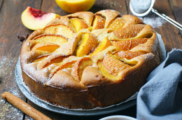istock Peach Pie over Wooden Background, Homemade Bakery 1497152511