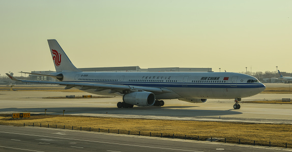 Beijing, China - Mar 1, 2018. An Airbus A330-300 airplane of Air China taxiing on runway at Beijing Capital International Airport (PEK).