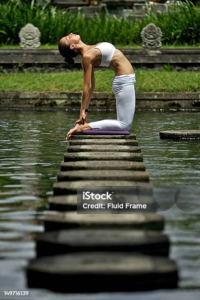 Woman Doing Yoga In A Garden Stock Photo - Download Image Now - Adult, Camel Pose - Ustrasana, Concentration