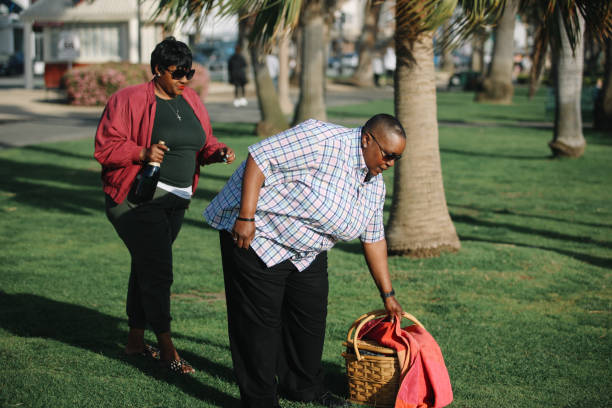 LGBTQ couple enjoying their time together in Santa Monica, LA, going for a casual outdoors picnic.