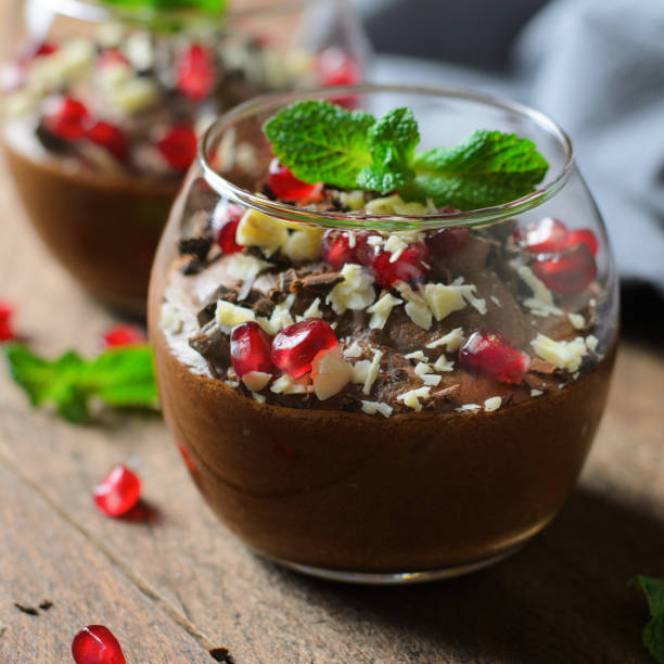 istock Chocolate Mousse Served with Pomegranate Seeds and Mint, Delicious Dessert 1497164498