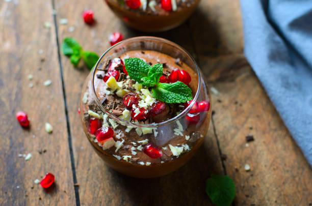 istock Chocolate Mousse Served with Pomegranate Seeds and Mint, Delicious Dessert 1497164543