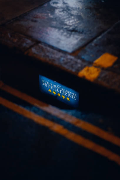 istock Les Miserables poster reflected in a puddle and night. West End, London 1497164714