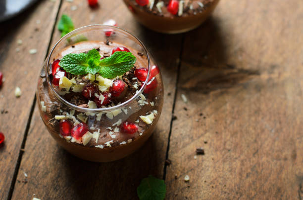 istock Chocolate Mousse Served with Pomegranate Seeds and Mint, Delicious Dessert 1497165999