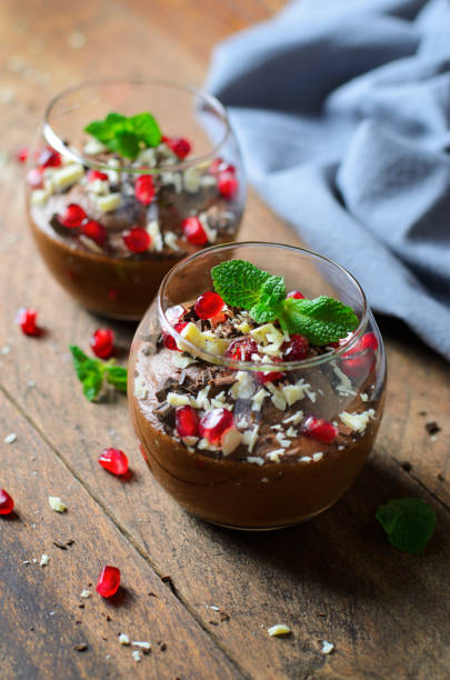 istock Chocolate Mousse Served with Pomegranate Seeds and Mint, Delicious Dessert 1497166015
