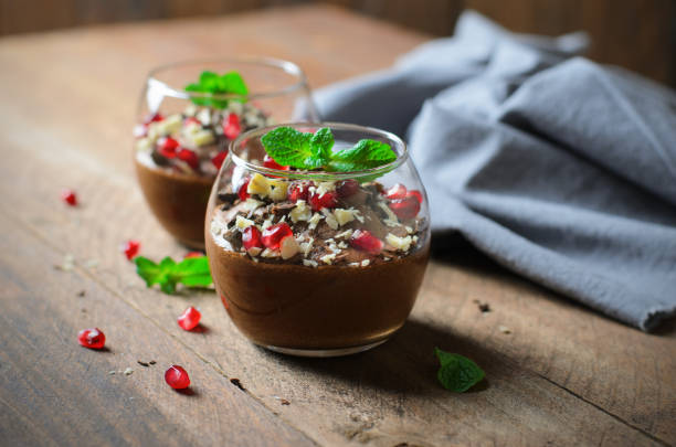istock Chocolate Mousse Served with Pomegranate Seeds and Mint, Delicious Dessert 1497166022