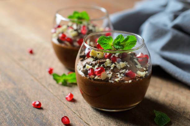 istock Chocolate Mousse Served with Pomegranate Seeds and Mint, Delicious Dessert 1497166029