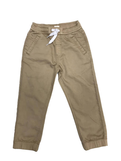 istock Stone color boys trouser with white drawcord knot fabric 1497166439