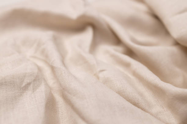 istock Natural linen fabric texture. Rough crumpled burlap background 1497168285