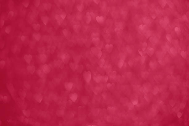 istock Magenta hearts bokeh background 1497168318