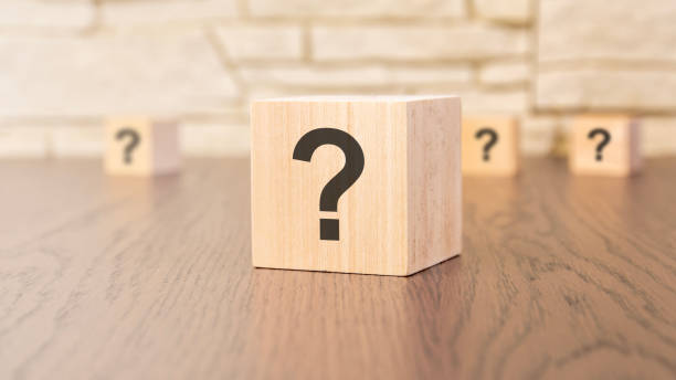 istock wooden blocks with question marks on wooden table, close up. space for text 1497170177