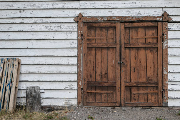 a closed door to old abandoned building