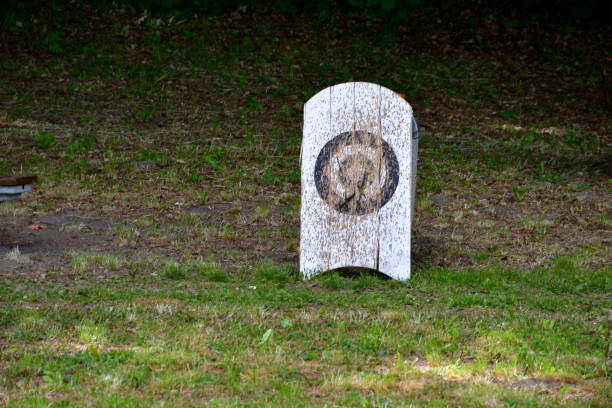 istock A view of a temporary shooting range prepared for an archery and crossbow competition with targets made out of rolled hay on wooden stands with the background being a cloth hanging from two sticks 1497170433