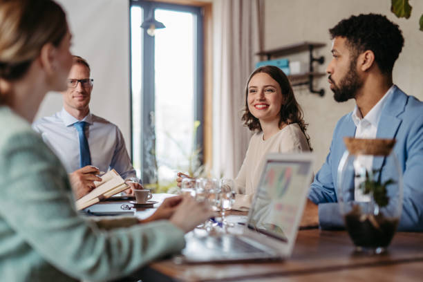 istock Young colleagues having casual discussion during meeting in office. 1497170849