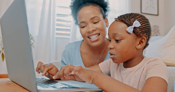 istock Child, mother, and laptop in family home for elearning, education software and learning. Black woman and girl kid with wifi to watch video, movies or streaming online talking research and internet 1497172291