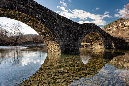 View of the traditional stone Mylos Bridge in Zagori of Epirus, Greece