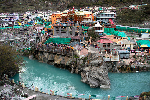 Badrinath,uttarakhand,India-Image of Badrinath temple from a distance showing alaknanda river in front.