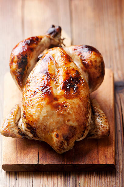 istock A roast chicken on a wooden kitchen board 149717706