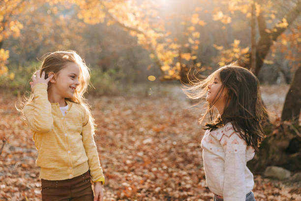 istock Cheerful children playing in the park 1497178458