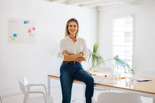 istock Business manager smiling happily in a creative office 1497179163
