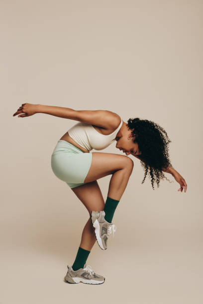 istock Balance and flexibility: Fit woman performing a workout pose 1497180534