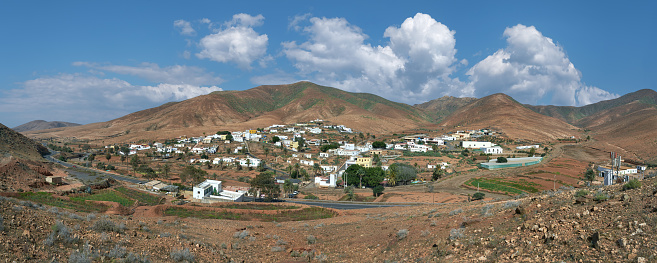 Toto, Fuerteventura, Canary Islands, Spain - panoramic view over the entire place from the south, with die mountains of the central mountain range behind