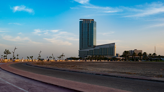A building at the seafront on the corniche of Al Khobar photographed at sunset