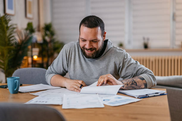 istock Man Checking Personal Finances at Home 1497187523