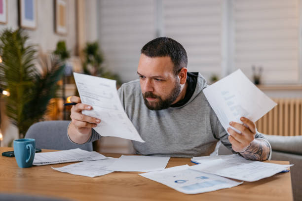 istock Man Checking Personal Finances at Home 1497188096
