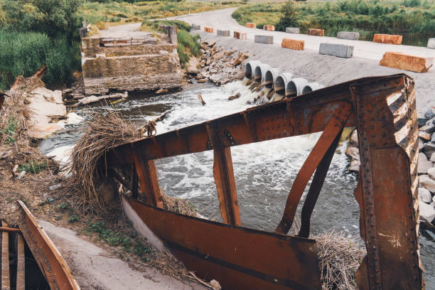 istock Bridge on the river, destroyed by the water flow 1497190697