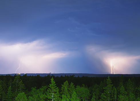 Lightning strikes from a distant thunderstorm. Long exposure.