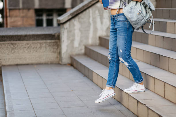 istock Female College Student Going Down The Stairs 1497193032
