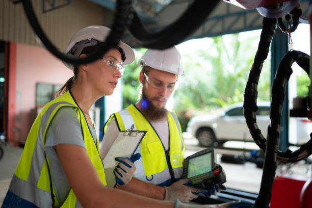 istock Both of engineers installing and testing a large robotic arm. before sending it to customers for use in the industry 1497197851