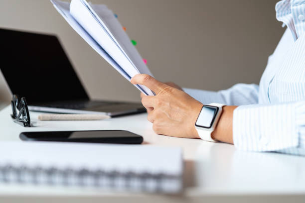 istock Financial documents in the hands of an accountant. 1497198019