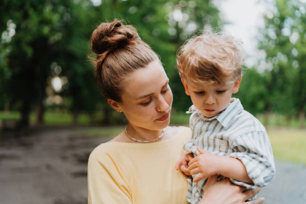 istock Young mother with little son on together walk after work day. 1497199121
