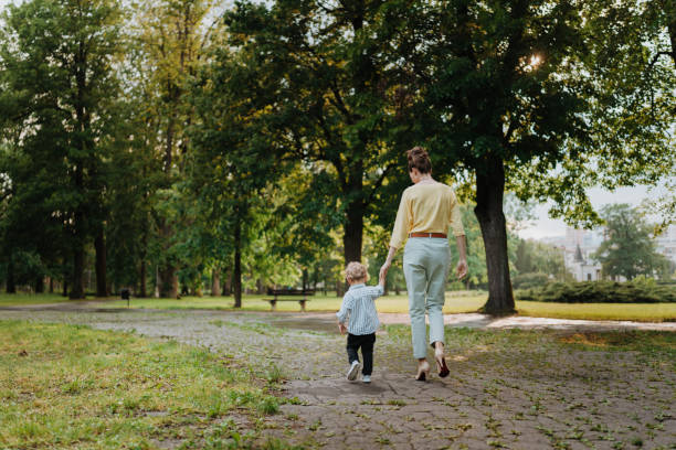 istock Young mother with little son on together walk after walk. 1497199413