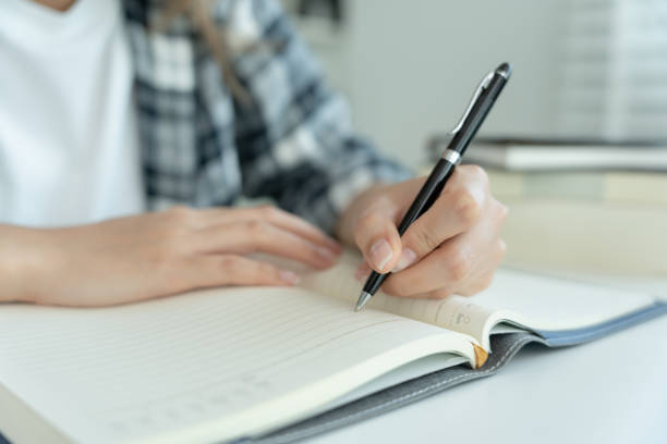 istock Student, use left-handed, inspiration, writer, writing ,creative ,recreation for imagine, writing ideas on notebook, to do list, good thinking work, journalist, Stylish, Dream image, relax, designer 1497199694