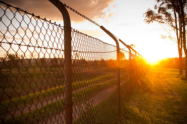 istock A wire fence with the sun shining on it. 149720170