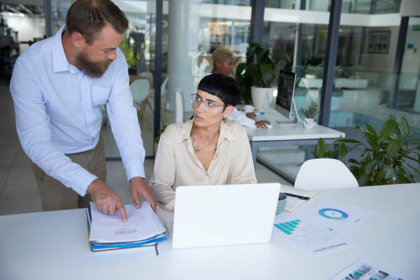 istock Boss comes in with more work to unhappy employee 1497202982
