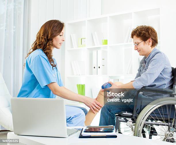 Disabled Woman With Artificial Leg At Doctors Office Stock Photo - Download Image Now